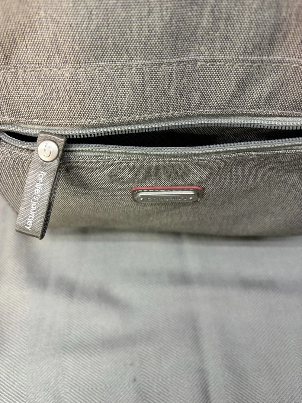 Baggallini all day backpack with handle multi pocket gray exterior blue interior
